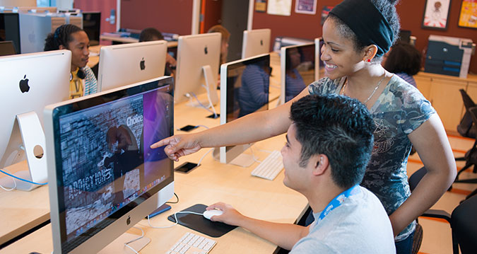 Student pointing at computer Student pointing at computer
