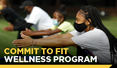 female student doing yoga on campus. text: Commit to fit wellness program