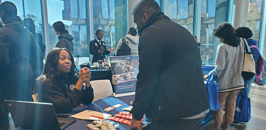 Student meeting at a table with a prospective health professional school