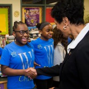 Bowie State University President Aminta Breaux with students at a local school